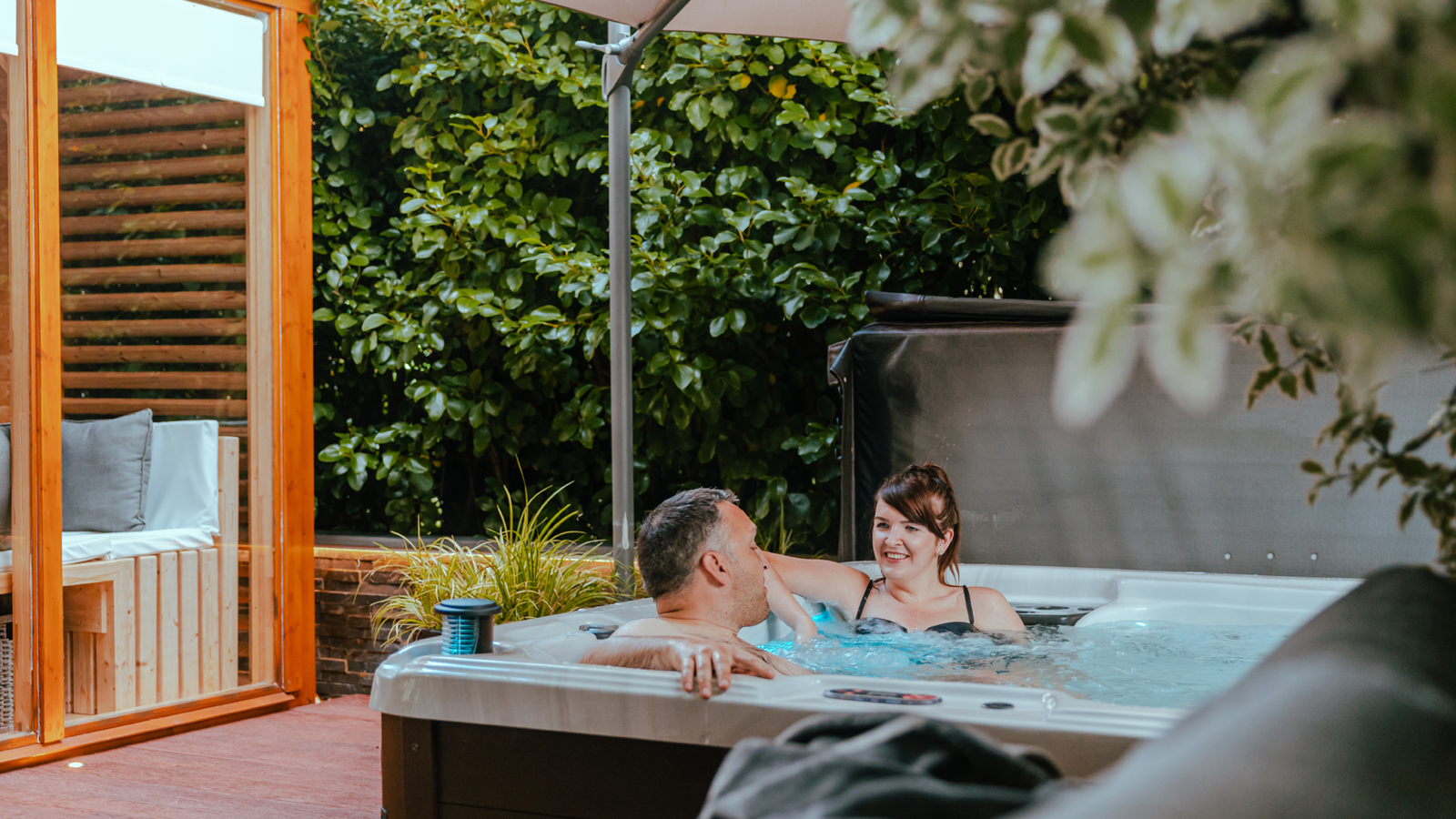 Couple in hot tub at Hilingford B&B